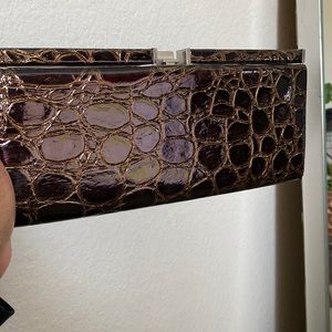 Crocodile inspired clutch purse.